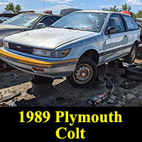 1989 Plymouth Colt hatchback in junkyard
